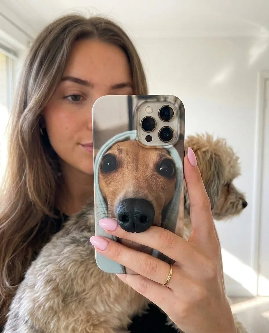 BoopNose Greyhound iPhone case held up in a selfie